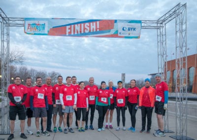 people at the finish line of the 2018 American Coatings Show Fun Run.