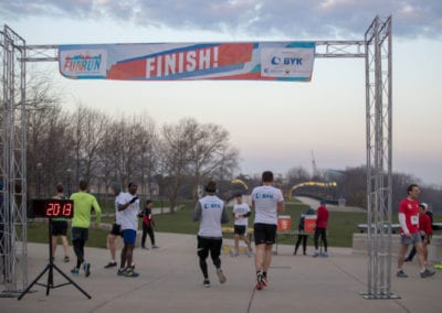people at the finish line of the 2018 American Coatings Show Fun Run.