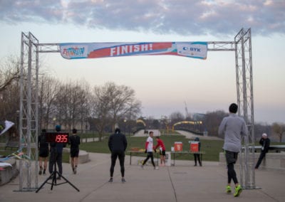people at the finish line of the 2018 American Coatings Show Fun Run.